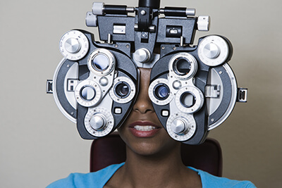 Woman having eyes examined