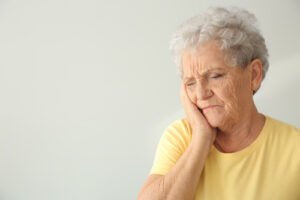 Woman leaning head on hand